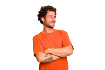 Young caucasian curly hair man isolated Young caucasian man with curly hair isolated smiling confident with crossed arms.