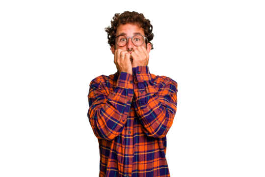 Young caucasian curly hair man isolated Young caucasian man with curly hair isolated biting fingernails, nervous and very anxious.