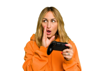 Young caucasian gamer woman holding a game controller isolated on green chroma background is saying a secret hot braking news and looking aside