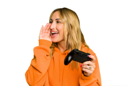 Young caucasian gamer woman holding a game controller isolated on green chroma background shouting and holding palm near opened mouth.