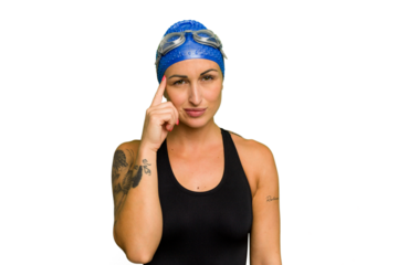 Young caucasian swimmer woman isolated on green chroma background pointing temple with finger, thinking, focused on a task.