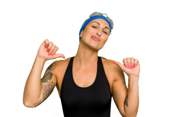 Young caucasian swimmer woman isolated on green chroma background feels proud and self confident, example to follow.