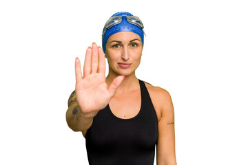 Young caucasian swimmer woman isolated on green chroma background standing with outstretched hand...