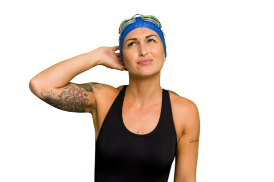 Young caucasian swimmer woman isolated on green chroma background touching back of head, thinking and making a choice.