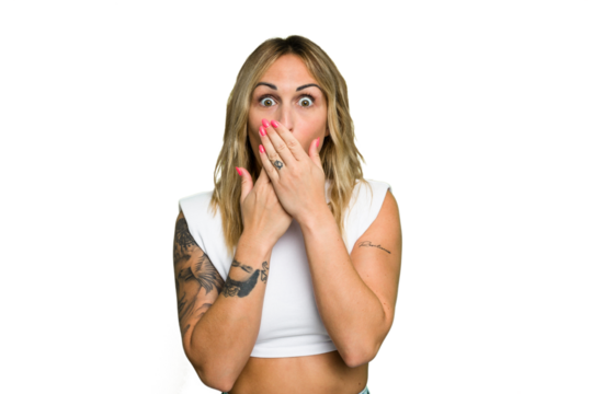 Young caucasian woman isolated on green chroma background shocked, covering mouth with hands, anxious to discover something new.