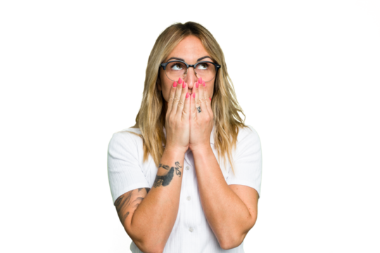 Young caucasian woman isolated on green chroma background thoughtful looking to a copy space covering mouth with hand.