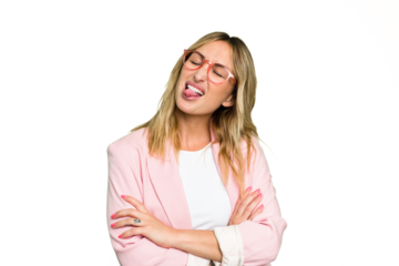 Young caucasian woman isolated on green chroma background funny and friendly sticking out tongue.
