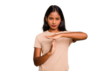 Young Indian woman isolated showing a timeout gesture.