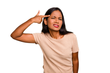 Young Indian woman isolated showing a disappointment gesture with forefinger.