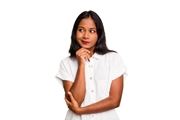 Young Indian woman isolated looking sideways with doubtful and skeptical expression.