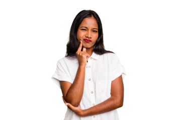 Young Indian woman isolated looking sideways with doubtful and skeptical expression.