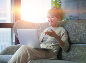 Woman concentrating as she works on a laptop