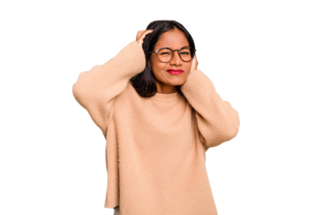 Young Indian woman isolated covering ears with hands.
