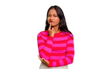 Young Indian woman isolated thinking and looking up, being reflective, contemplating, having a fantasy.