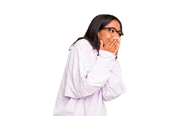 Young Indian woman isolated laughing about something, covering mouth with hands.