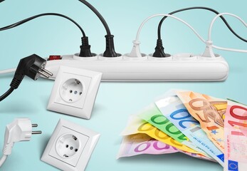 Electric plugs and money banknotes for electricity prices.
