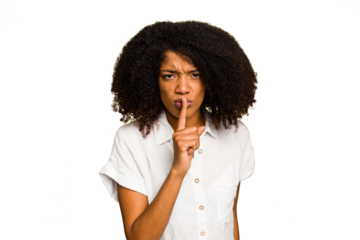 Young African American woman isolated keeping a secret or asking for silence.