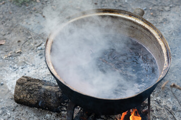 View of grapes boiling in the cauldron. Molasses, grape juice decoction, turkish name: pekmez....