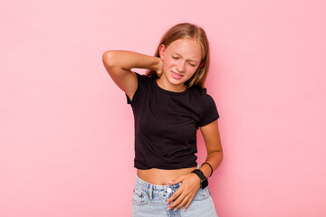 Caucasian teen girl isolated on pink background suffering neck pain due to sedentary lifestyle.