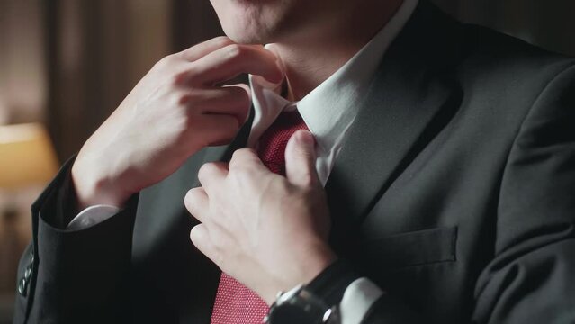 Close Up Of A Man In Jacket And White Classic Shirt Wearing Red Necktie. Dressing For Celebration Event, Business Meeting Or Wedding
