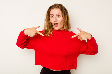 Young caucasian woman isolated on white background points down with fingers, positive feeling.