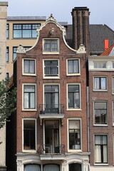 Fototapeta na wymiar Amsterdam Single Canal House Facade with Bell Gable, Netherlands