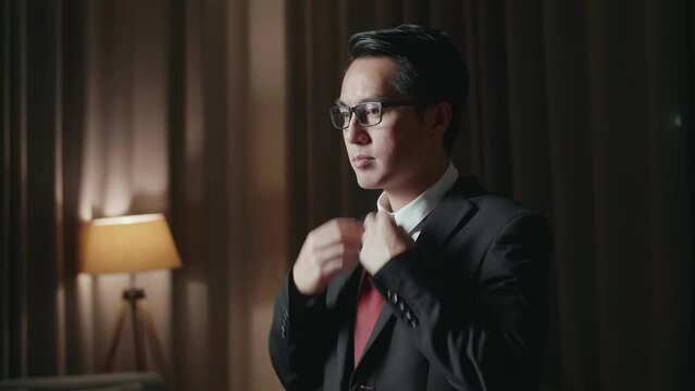 Asian Man In Jacket And White Classic Shirt Wearing Red Necktie. Dressing For Celebration Event, Business Meeting Or Wedding
