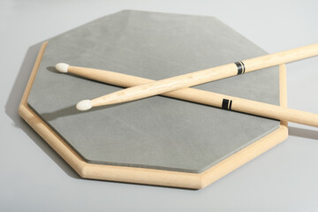 Percussion Instruments Music School, training pad and drumsticks. learning music, music education. © Yulia Panova