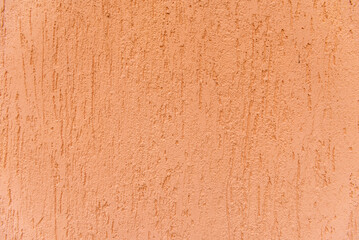 The background of the orange wall, plastered surface. Top view.