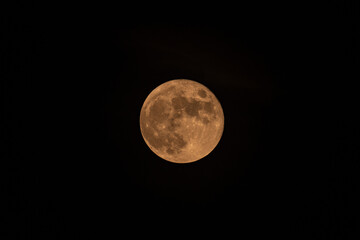 Full yellow moon with black background