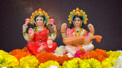 Statue of Indian God Lakshmi and Saraswati. Hindu gods. Holiday banner or greeting card for Indian festival Happy Diwali.