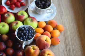 Various healthy seasonal food arranged on wooden background. Selective focus.