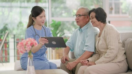 Group of asian senior people listening to young nurse.Psychological support group for elderly therapy session in a community centre. Group therapy in session sitting in a circle in a nursing home.
 - Powered by Adobe