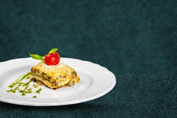 Tasty fresh lasagna dish on white plate