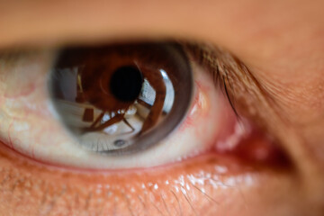 human male eye close-up tan human skin