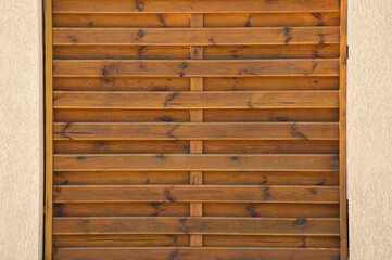 Brown grunge wood texture of a wooden fence with metal screws on it. Abstract wood texture good for background.