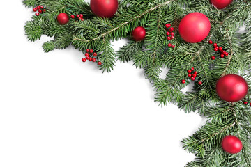 Obraz na płótnie Canvas Christmas toys on fir tree branch , isolated on white