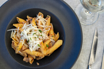 Pasta plate with porcini mushrooms and cheese.