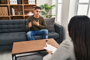 Man and woman having psychology session at clinic