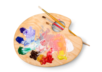 Wooden art palette with blobs of paint and a brushes on white background