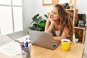Fototapeta premium Young beautiful hispanic woman business worker using laptop working at office