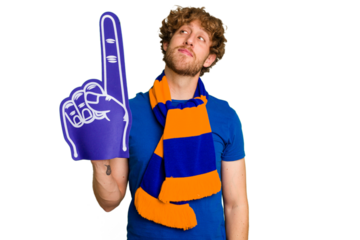 Young caucasian sports fan man isolated on white background dreaming of achieving goals and purposes