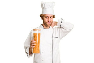 Young cook man isolated on white background touching back of head, thinking and making a choice.