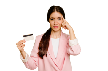 Business caucasian woman holding a credit card isolated pointing temple with finger, thinking, focused on a task.