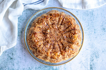 Hazelnut cake. Homemade cake on gray background. close up