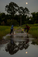 Obraz na płótnie Canvas Children playing on flooding in rural 