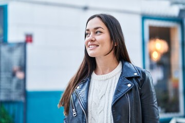 Young woman smiling confident standing at street