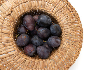 ripe plums isolated on white background, top view