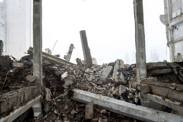 The destroyed big concrete building in a foggy haze. Background.