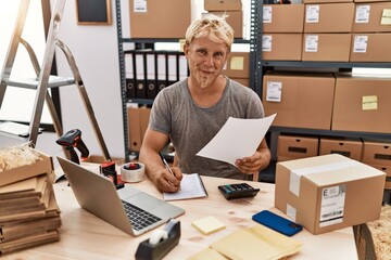 Young caucasian man smiling confident working at warehouse